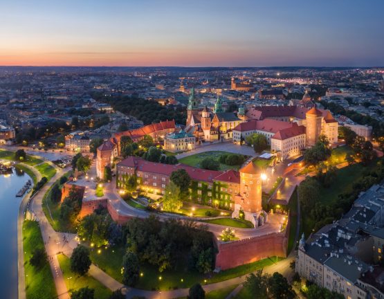 Krakow, Poland. Aerial view of illuminated Wawel Royal Castle on sunset